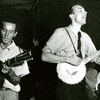 Woody Guthrie, at left with guitar, and Pete Seeger, with banjo